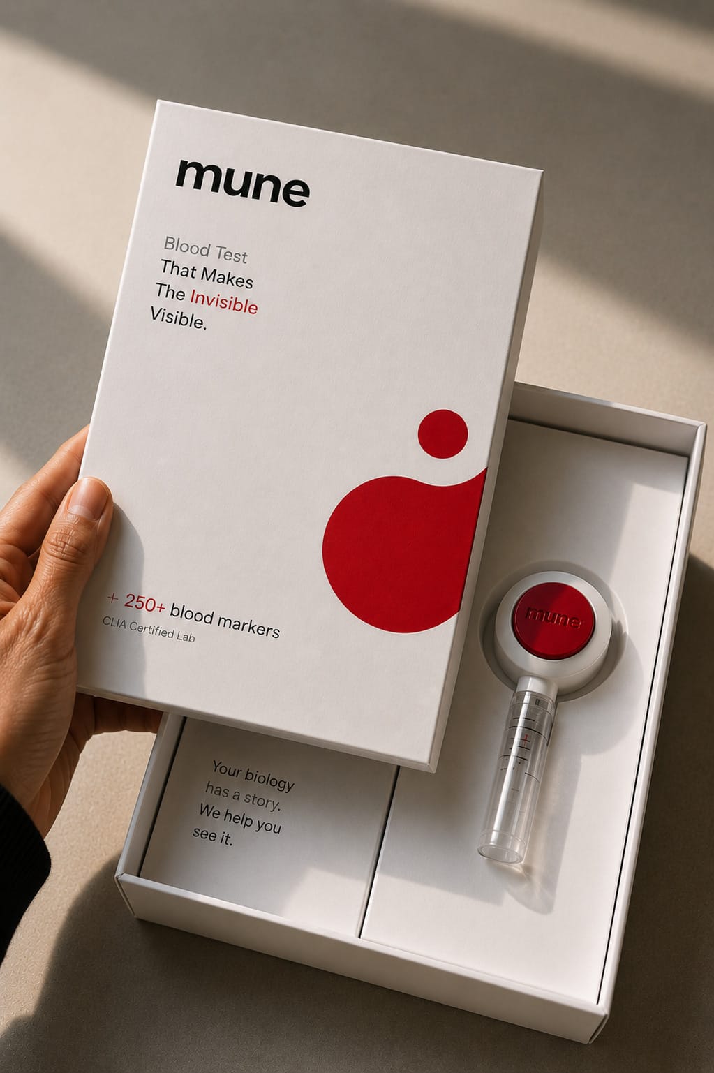 The Mune blood test kit, box open with the collection device inside